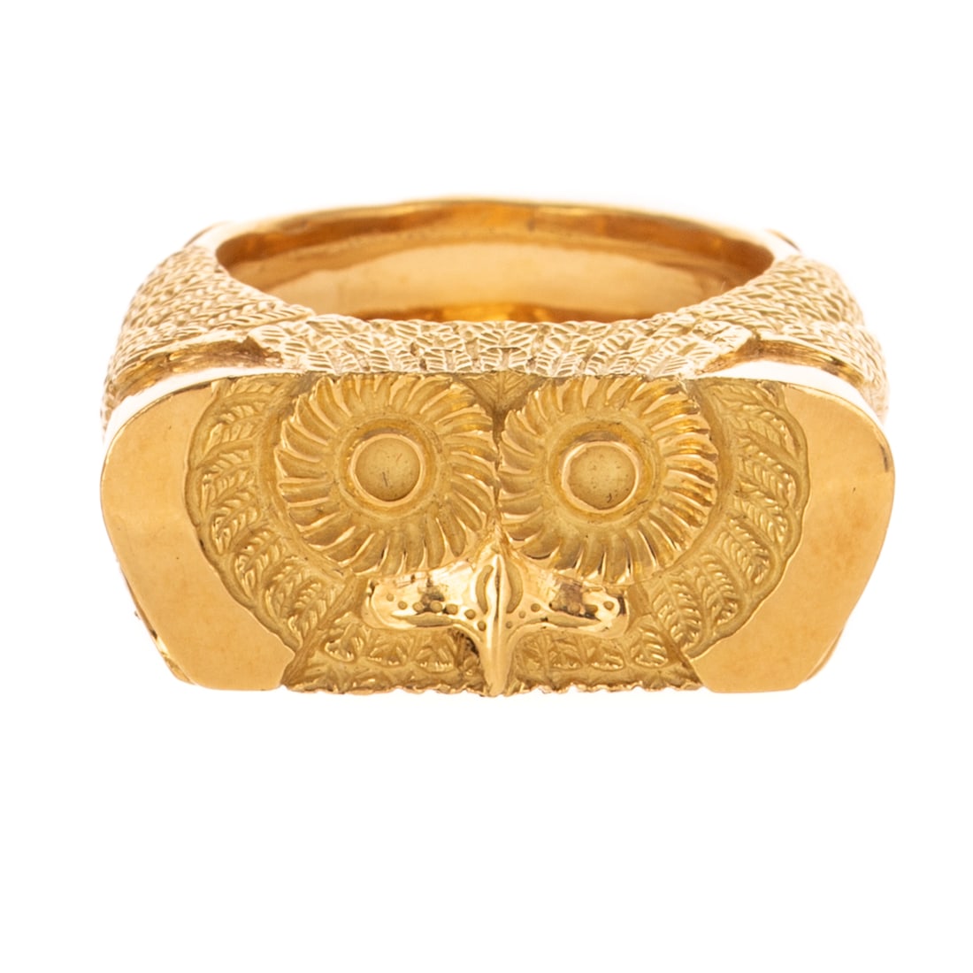 A Rare Tiffany & Co. Owl Ring in 18K: 18K yellow gold ring by Tiffany & Co, Germany, designed by Gene Moore, featuring a highly detailed carving of an owl's head with detailed feathers and claws throughout, solid 11 mm wide shank, signed,