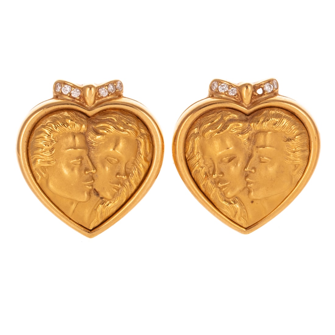 A Pair of Carrera Y Carrera Earrings in 18K: c.1990s, 18K yellow gold earrings by Carrera y Carrera earrings designed with portrait of Romeo & Juliet in heart shape design with diamonds at the top, posts with hinge backs, signed and numbered #16