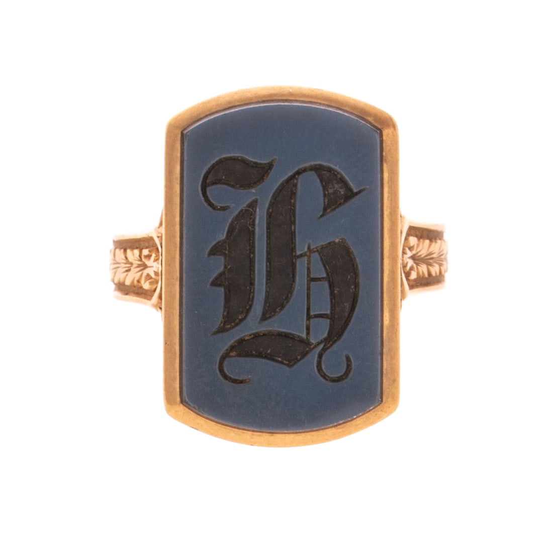 A Sardonyx Signet Ring in 18K: 18K yellow gold signet ring featuring an elongated carved sardonyx plaque measuring approx. 3/4 in. x 1/2 in., carved foliate details on the shank, sz 8.25, 7.6 grams Provenance: From a Baltimore esta