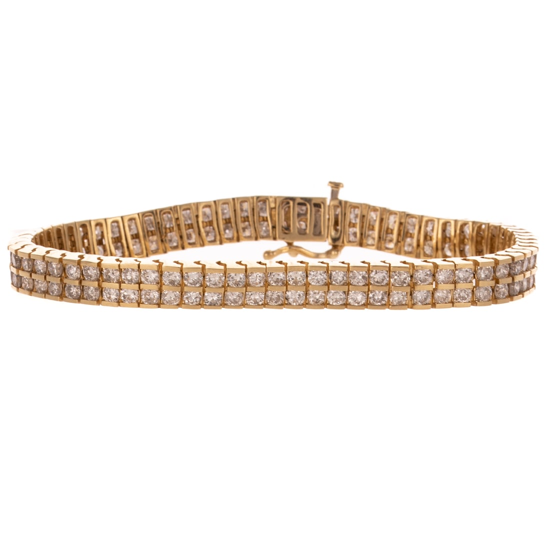 A 10.00 ctw Double Row Diamond Bracelet in 14K: 14K yellow gold double row diamond bracelet featuring well matched round diamonds weighing approx. 10.00 ctw with an average color grade of G - H and an average clarity grade of VS2 - SI1, bar set, hi