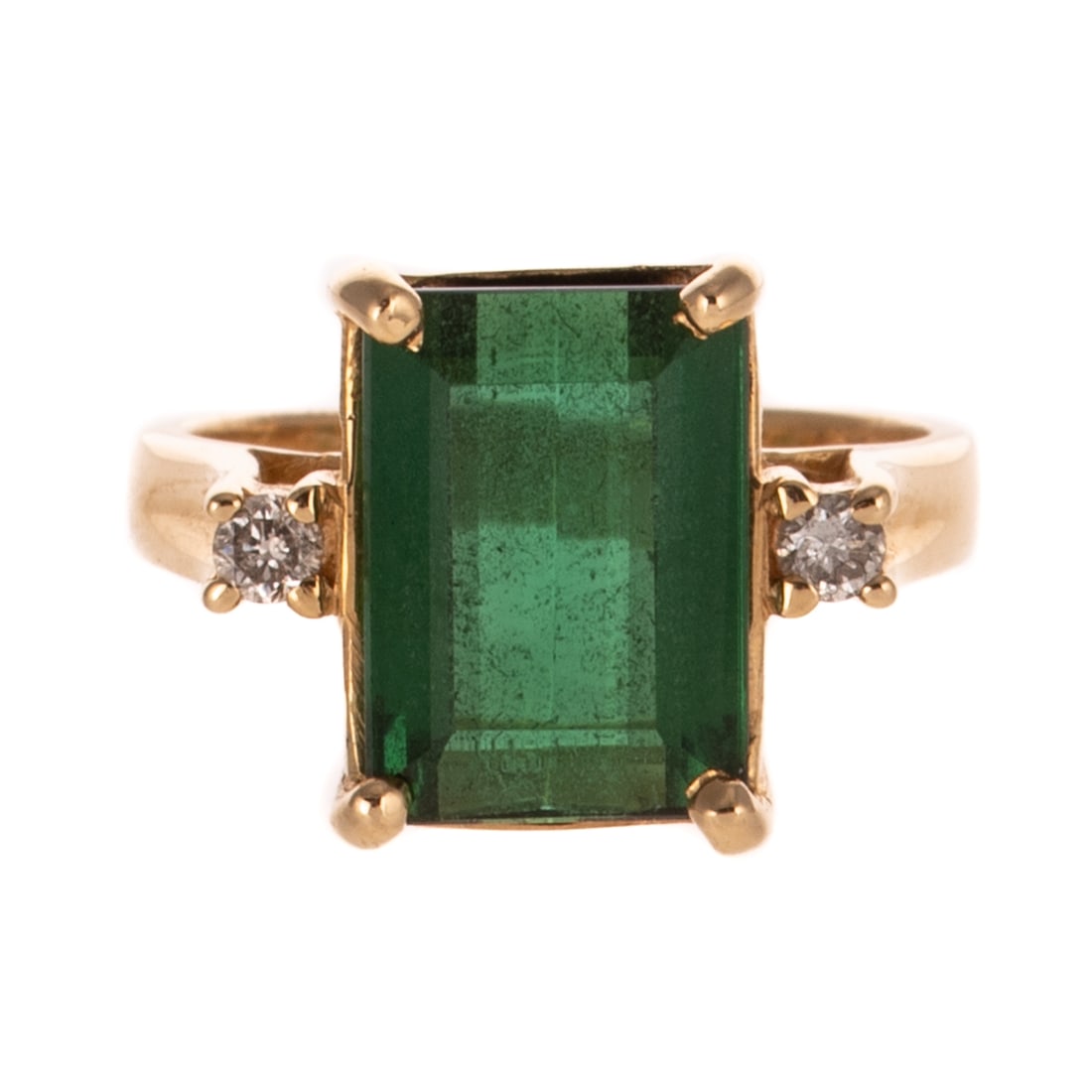 A Green Tourmaline & Diamond Ring in 14K: 14K yellow gold ring featuring an emerald cut green tourmaline measuring 12.0 x 8.6 mm, prong set in a basket head and flanked by two round diamonds weighing approx. 0.12 ctw, sz 6.5, 5.5 grams Proven