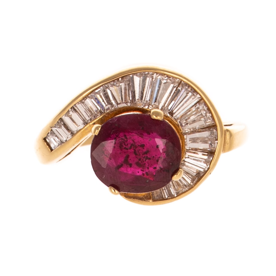 A Ruby & Diamond Swirl Ring in 18K: 18K yellow gold ring featuring an oval fine bright red ruby weighing approx. 2.20 carats set in prongs with a channel of baguette diamonds weighing approx. 0.40 ctw set in a swirl, sz 6, 5.9 grams