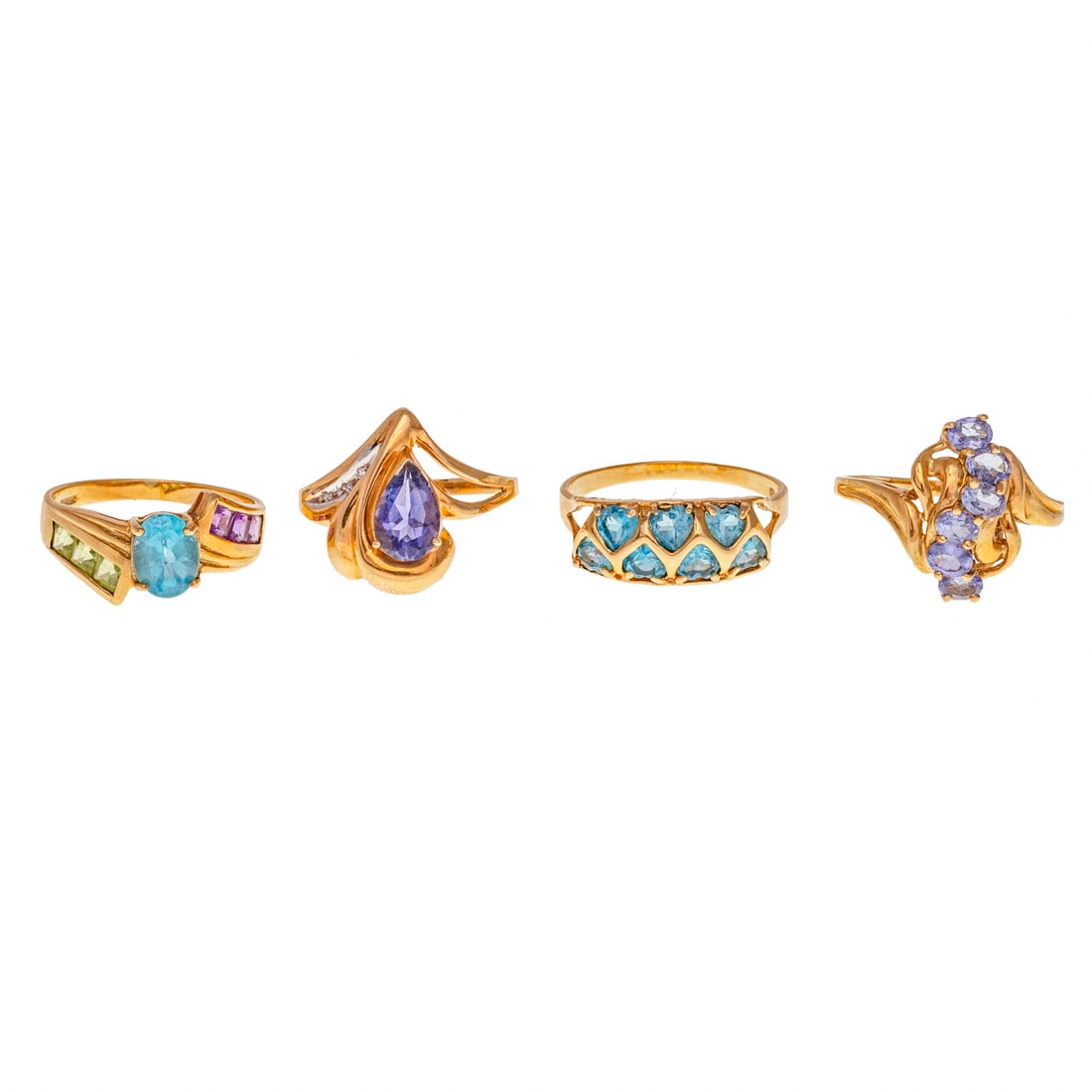 A Collection of Gemstone Rings in 10K: 1) 10K yellow gold ring featuring oval blue topaz with channel set peridot and amethyst in bypassing design, sz 8.75, 2) 10K yellow gold double row band with heart shape blue topaz, sz 10, 3) 10K yell