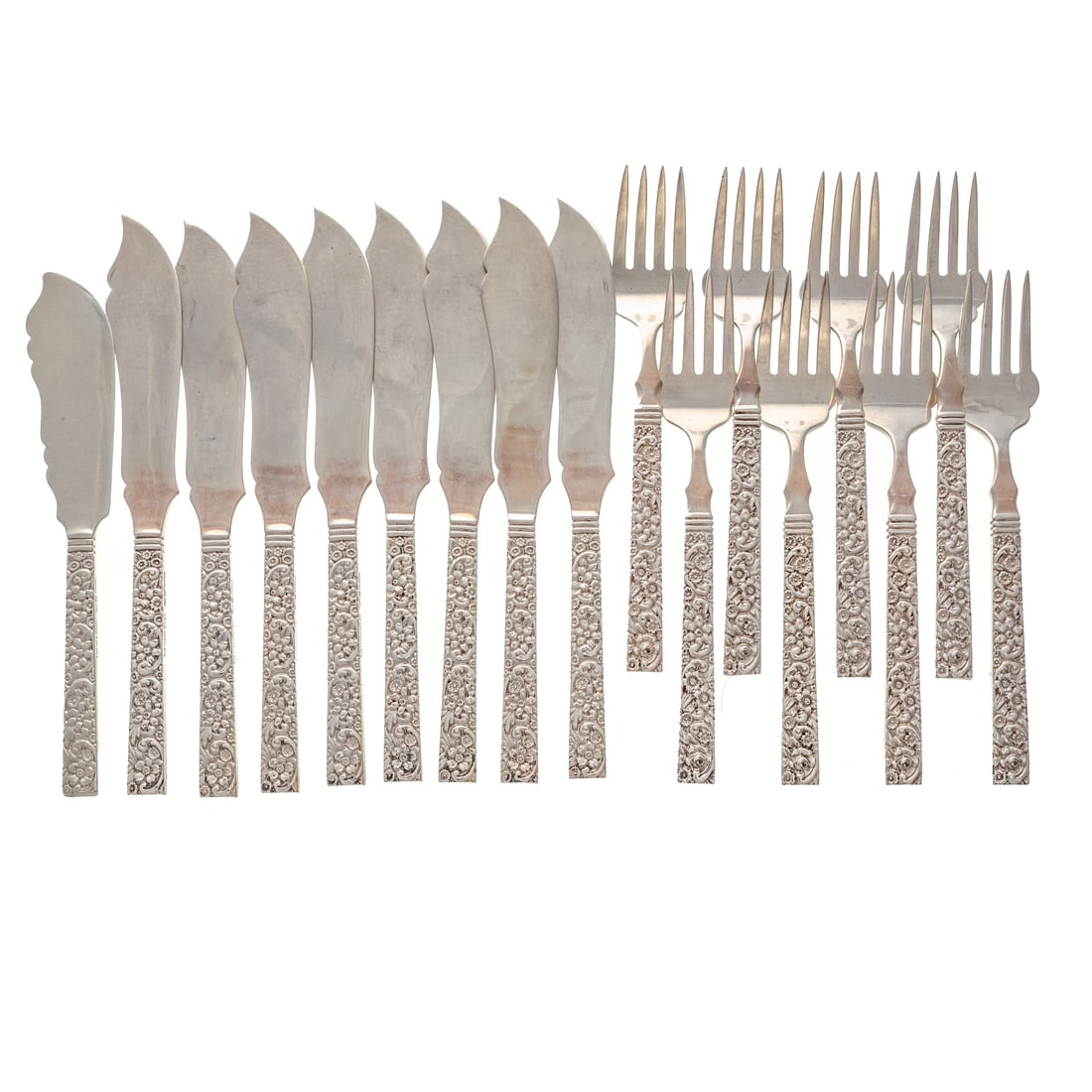 16-Piece Jacobi & Jenkins Sterling Fish Service: Baltimore, 1894-1908, retailed by J.E. Caldwell, Philadelphia, comprising: eight flat fish knives and eight forks, the handles cast with scrolls and flowers, 6 1/2 in. to 7 3/4 in. L, with an