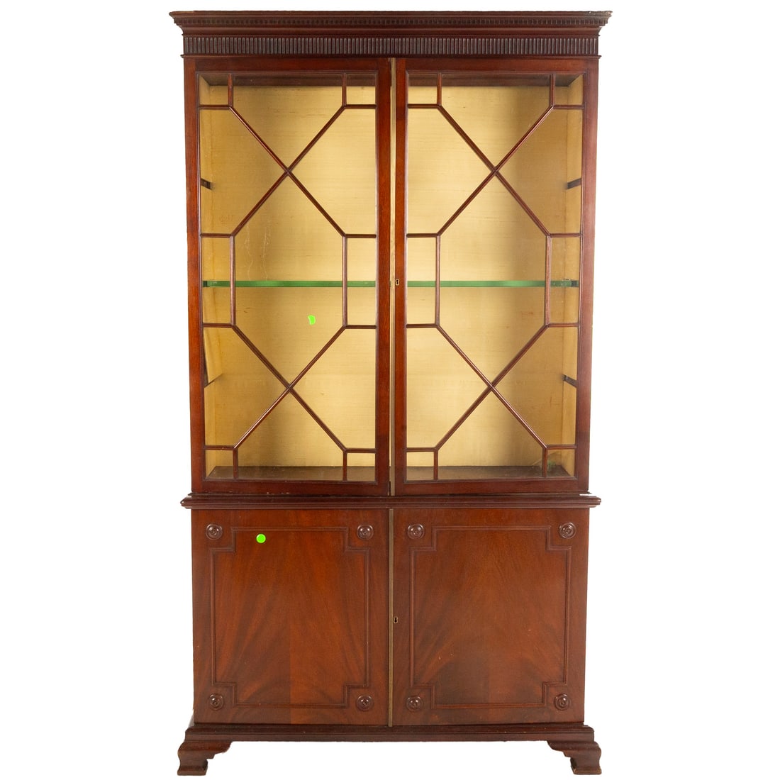 George III Mahogany China Cupboard: Circa 1800, dentil and fluted cornice over two glazed doors, resting on a carved two door cabinet resting on bracket feet, 88 in. H, 48 in. W, 13 1/4 in. D