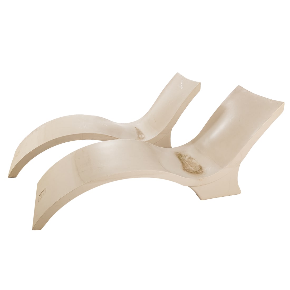 A Pair of Outdoor Patio Ledge Loungers: A pair of molded plastic poolside loungers, 31 in. H, 81 in. W, 23 in. D