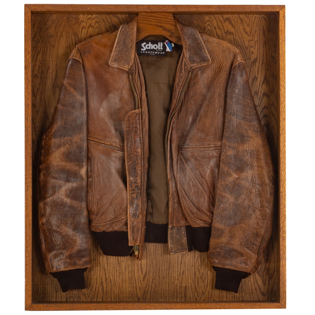 Keith Haring Signed Leather Jacket, 1988: (American, 1958-1990) Keith Haring signature on a Schott NYC Sportswear brown leather men's jacket hand signed in black sharpie and dated "K. Haring" on the right lapel, features two doodles by the