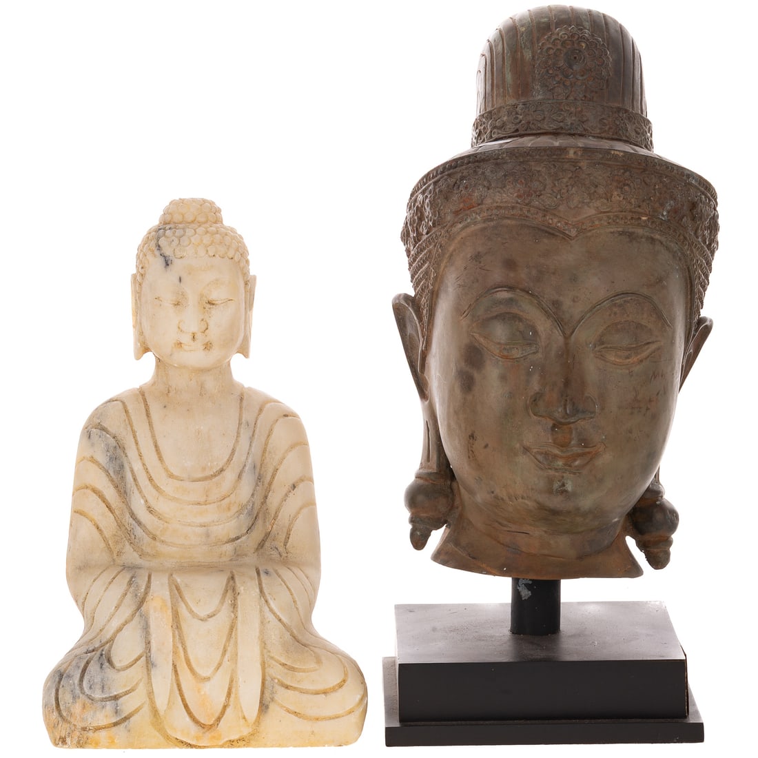 A Thai Patinated Metal Head of Buddha & a Marble Seated Buddha: A Thai patinated metal head of Buddha on stand, 18 in. H on stand, 9 in. W on stand; and a carved marble seated Buddha, 13 1/4 in. H, 8 1/4 in. W, approx. 4 3/4 in. D Provenance: From the Estate of