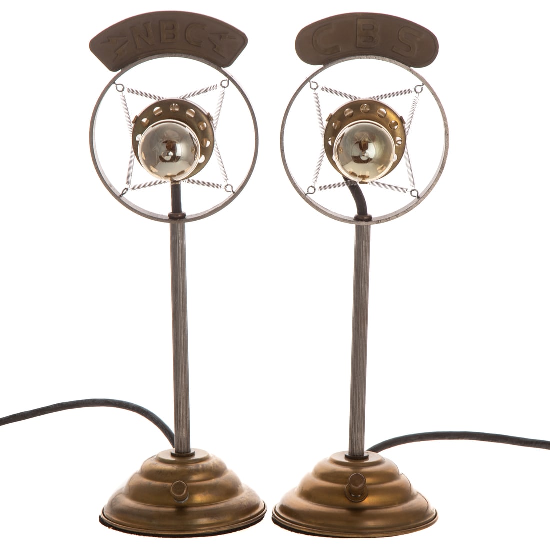 A Pair of Illuminated CBS Microphones: A pair of brass and metal illuminated CBS microphone lights in the carbon spring mounted microphone style with dimmer, includes bulbs and extension cord, 15 1/2 in. H, approx. 5 1/4 in. W