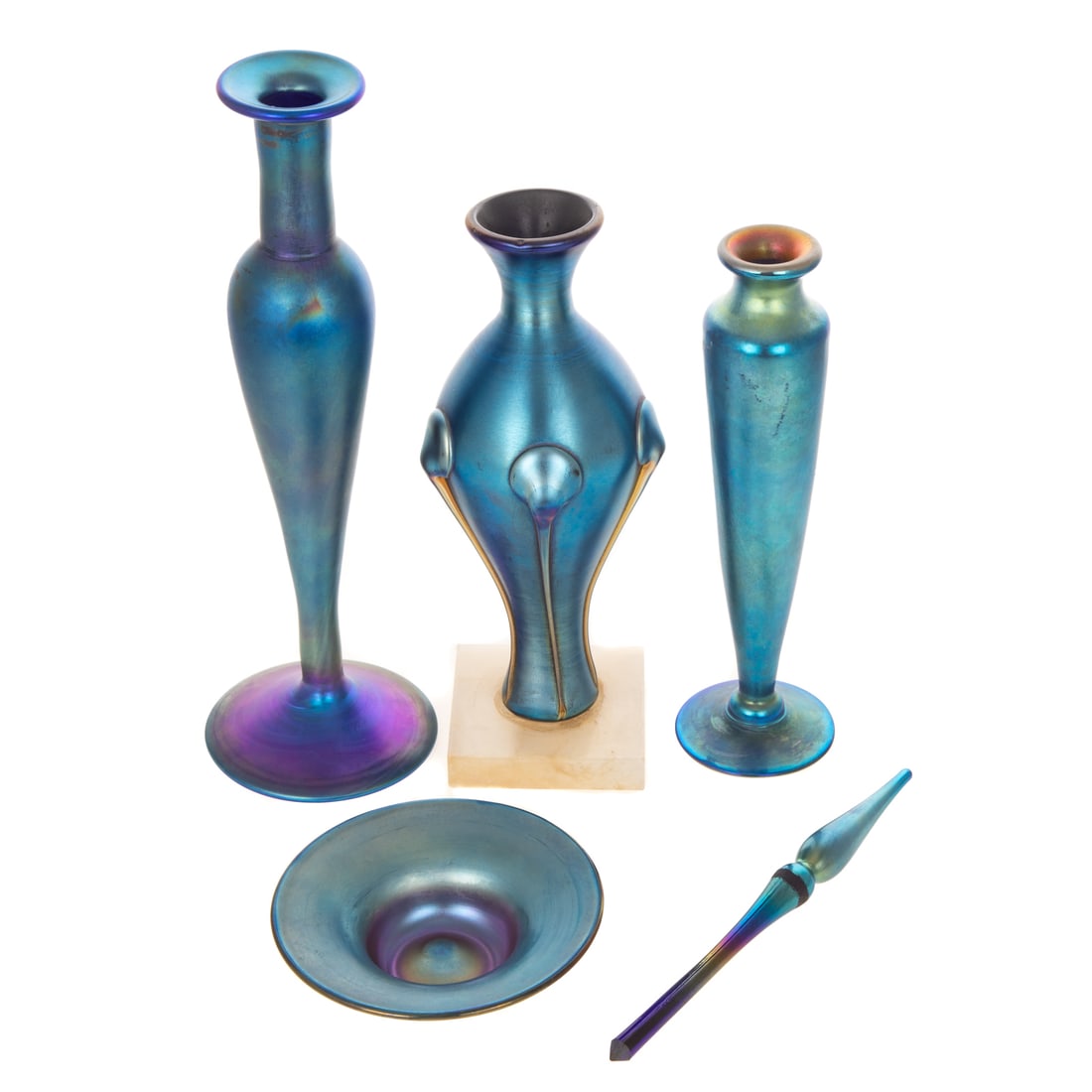 Four Blue Iridescent Art Glass Vessels: Consisting of a five-lobed manner of Tiffany Studios vase, a covered perfume with gold shoulder and interior lip, a candlestick form vase, and a shallow dish, size of tallest: 11 in. H