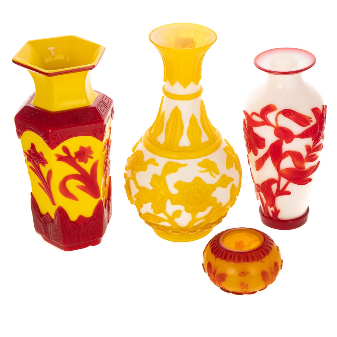 Four Chinese Peking Glass Cameo Vases & Vessels: 20th century, including: a red cased yellow hexagonal, yellow cased white pear-shaped, red cased white baluster vases and a red cased yellow water pot, size of tallest: 9 in. H
