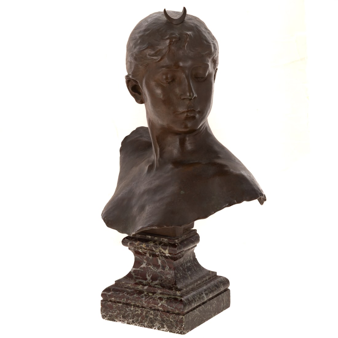Thiebaut Fr?res Patinated Bronze Bust of Diana: After Alexandre Falguiere (French, 1831-1900) Mottled light brown and olive patina bronze on variegated red marble, 14 1/4 in. H