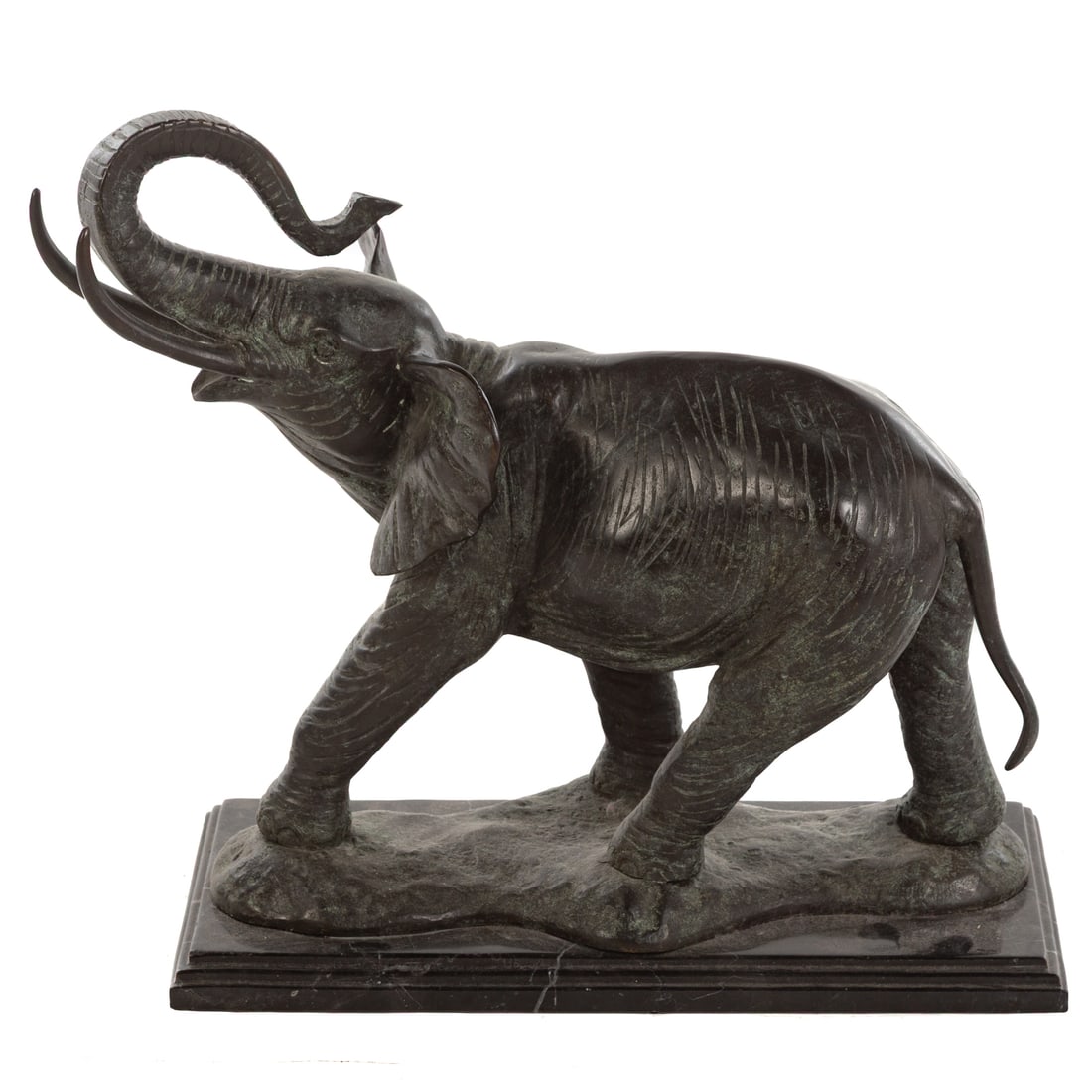 Large Elephant Bronze: Patinated bronze elephant sculpture atop a black metal base, featuring an elephant mid stride with trunk raised and tusks visible, unsigned, 18 in. H, 18 in. W, 10 in. D