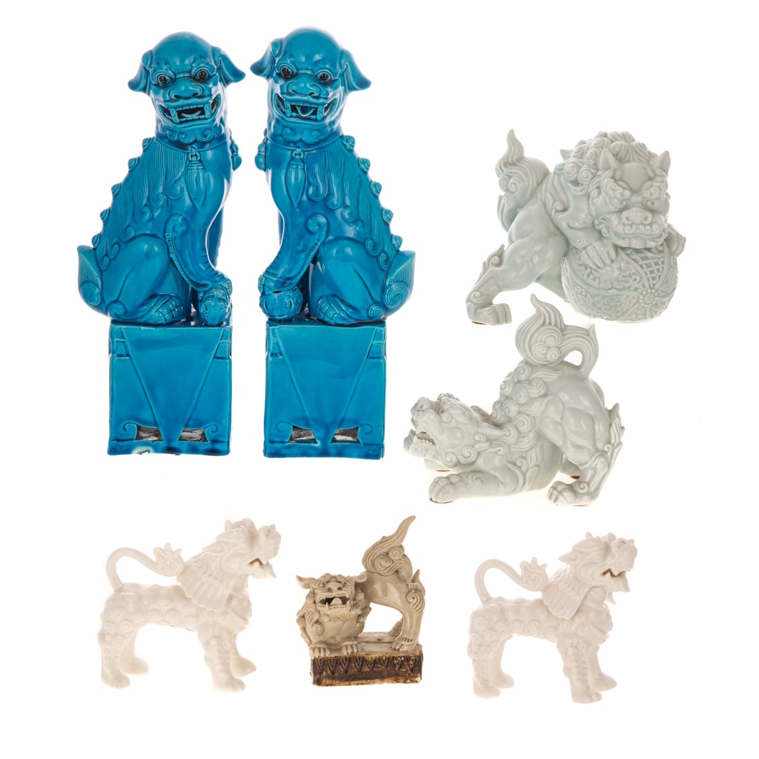 Collection of Ceramic Foo Dogs: Including: a pair of turquoise glazed, 12 1/4 in. H; a pair of celadon, 5 1/2 in. H; a pair of Japanese blanc-de-chine, 4 3/8 in. H, and a single in stoneware, 4 1/4 in. H