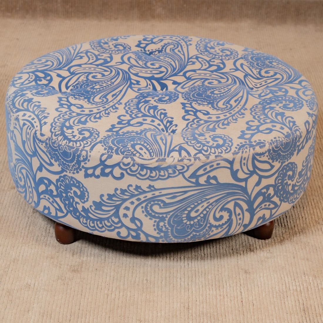 Contemporary Upholstered Hassock: Fully damask and buttoned upholstered hassock supported by four turned legs, 14 in. H, 36 in. Diam.