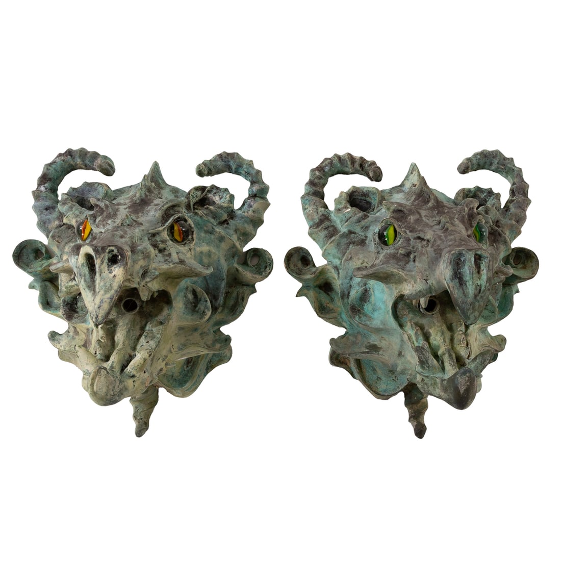 A Pair of Contemporary Dragon Head Fountain Spouts: Patinated metal figural spouts with glass eyes, each: 14 1/2 in. H, 12 1/2 in. W, 11 1/2 in. D
