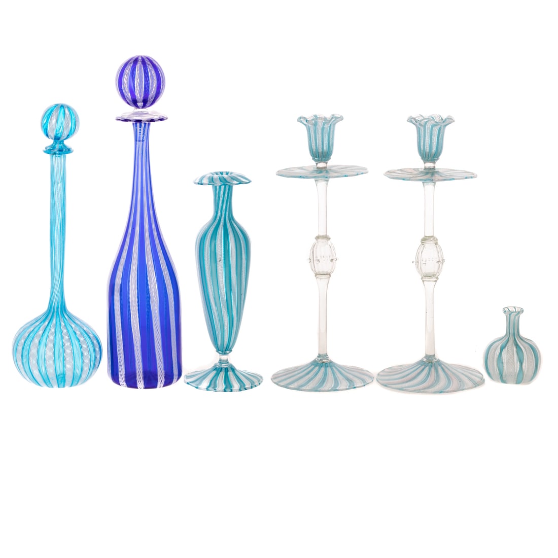 Collection of Italian Latticino Glass: Including: a pair of candlesticks, 11 3/4 in. H; two bottles with stoppers, and two vases