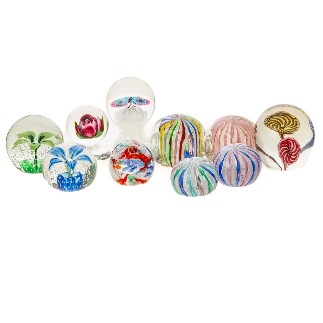 Collection of 10 Assorted Art Glass Paperweights: Including: Bohemian cased morning glory; an Italian cased lampwork butterfly on Laticcello bed 4 3/4 in. H pedestal; one marked and one unmarked controlled bubble and lampwork flower; a signed cased l
