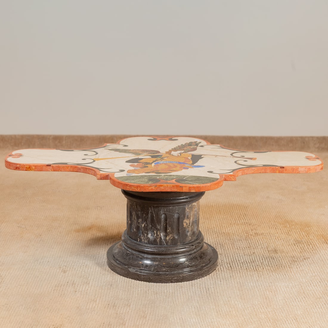 Italian Pietra Dura Coffee Table: Shaped top with pietra dura inlay depicting an allegory of fame, resting on a pedestal base, 17 in. H, 48 in. W, 31 in. D