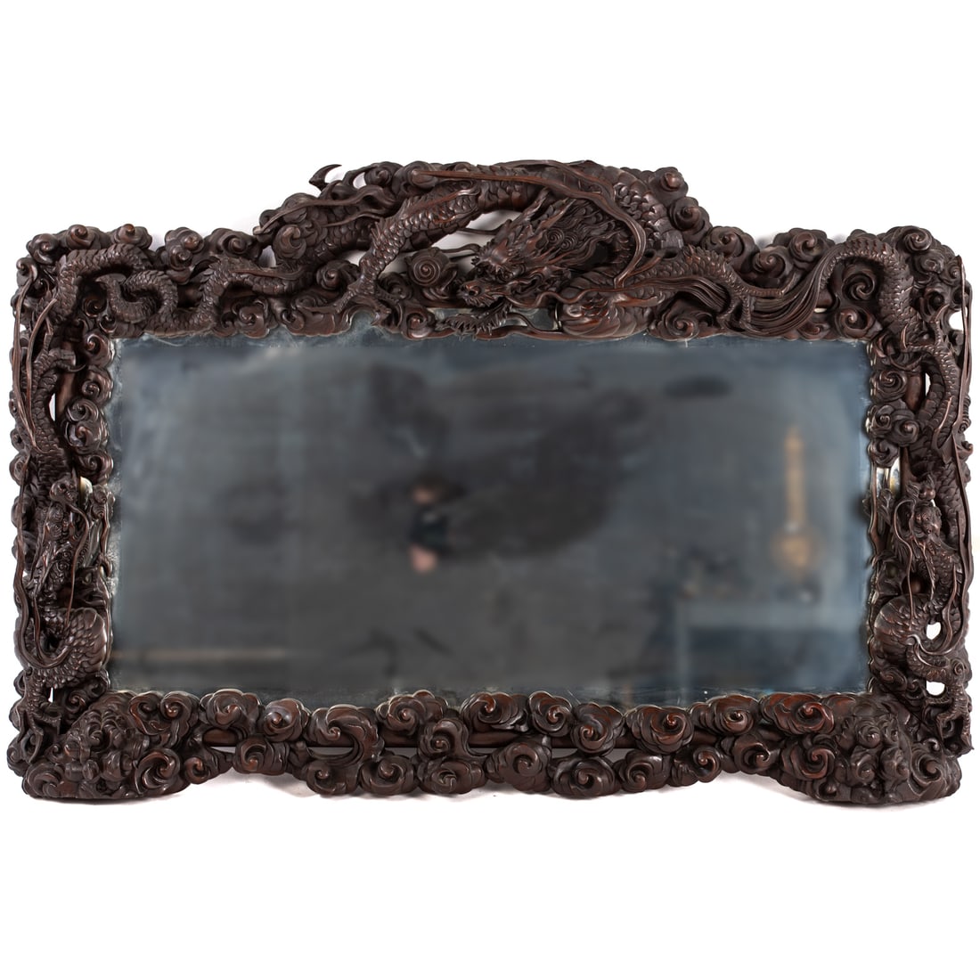 Chinese Carved Rosewood Mirror: 20th century, rectangular, featuring three dragons, one with the flaming pearl, 32 1/2 in. H, 49 1/2 in. W