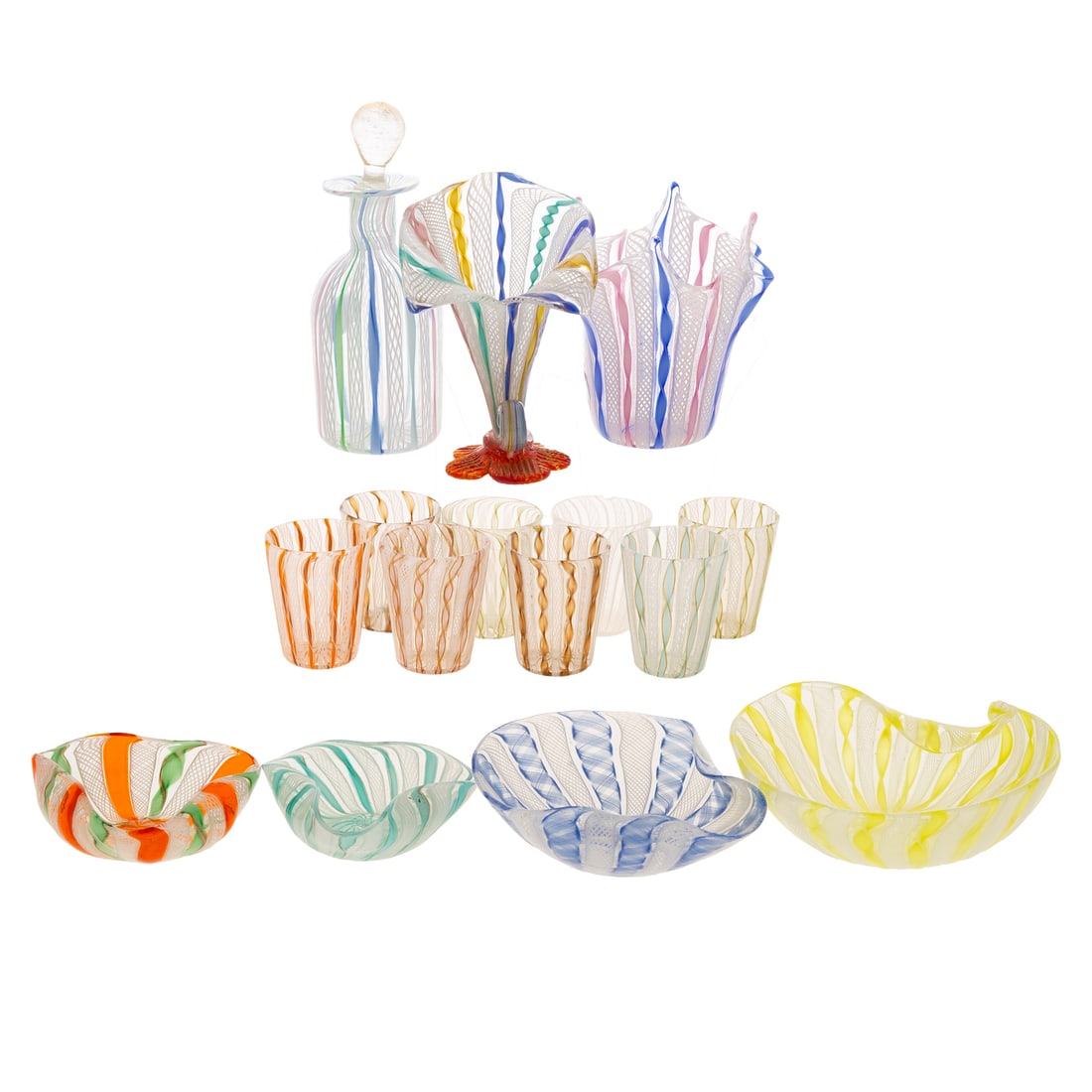 15 Pieces of Venetian Latticino Art Glass: Comprising 15 pieces of Venetian Latticino ribbon twist art glass; includes eight small glasses, handkerchief vase, bottle with stopper, cornucopia vase, four small dishes with folded rims, size of