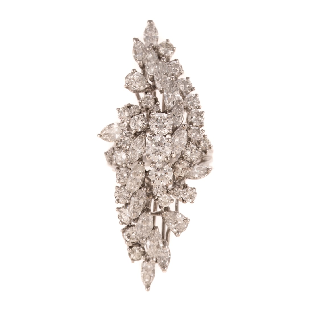 A 7.50 ctw Diamond Cocktail Ring in 14K: 14K white gold ring featuring an elongated cluster of marquise and round diamonds, weighing approx. 7.50 ctw all prong set with an average color grade of approx. H - I and an average clarity grade of