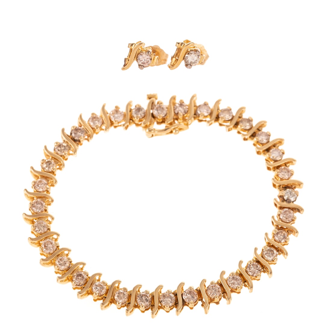 A 4.80 ctw Diamond "S" Link Bracelet & Earring Set in 14K: 14K yellow gold "S" link bracelet featuring prong set round light cognac diamonds weighing approx. 4.80 ctw and with an average clarity grade of SI, hidden box clasp with safety latch, 6 1/2 in. L; to