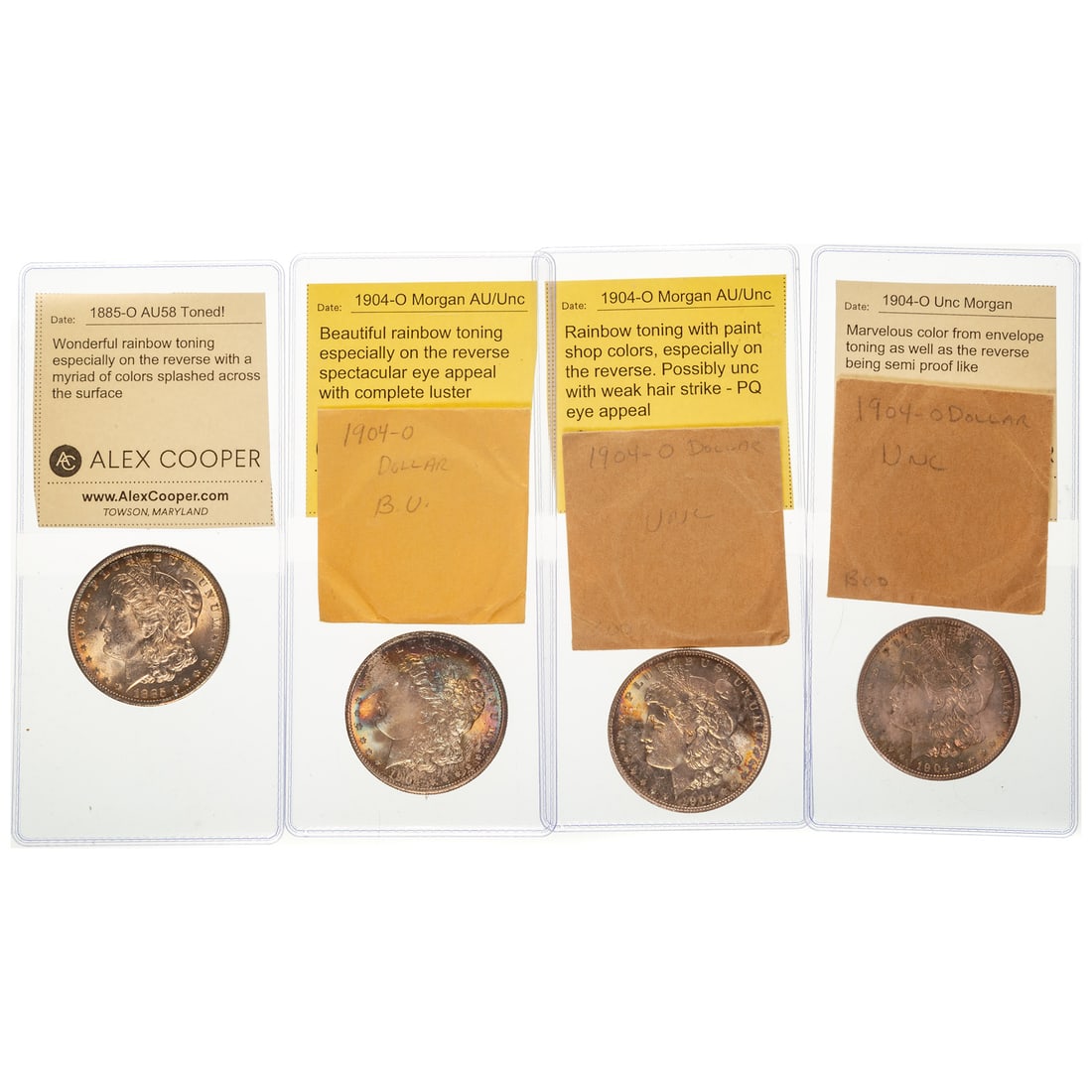 Four Attractively Toned Morgan Iridescent Rainbows: 1885-O AU58 - album toning on obverse with rainbow toning on the reverse with a myriad of colors and luster 1904-O - AU/Unc and much closer to Unc with iridescent rainbow toning on both sides with an