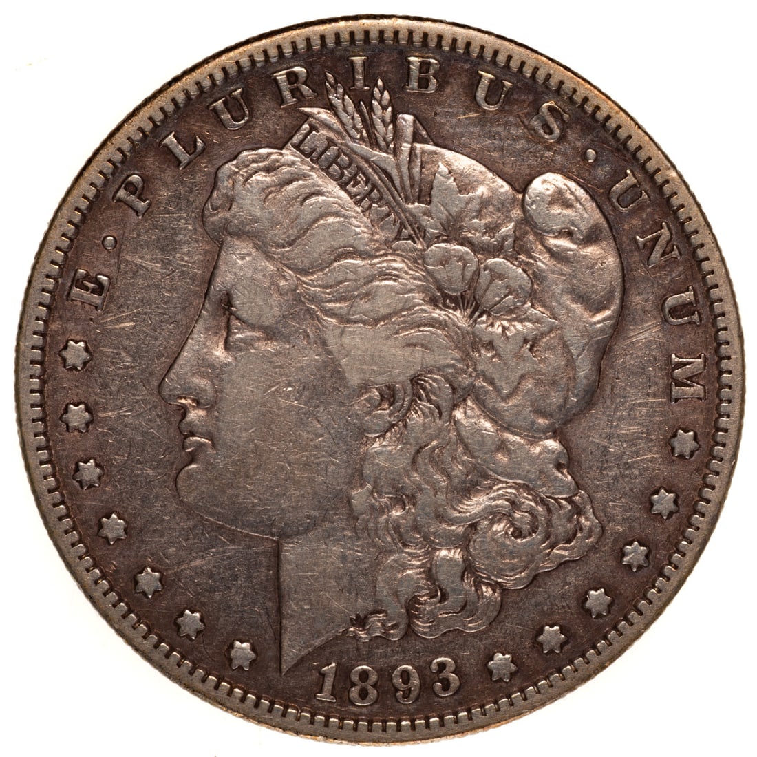 1893-S Morgan Fine Cleaned: The key date in the series for business strikes at a mintage of 100,000. This has the two main diagnostics for a 93-S, the rabbit ears at the bottom foot of the R in LIBERTY and the die line at the to