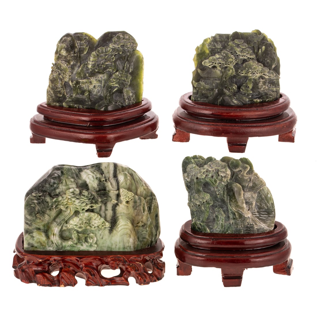 Four Chinese Carved Jade Landscapes: 1) A green Chinese carved jade landscape depicting a man seated under a tree with a structure in the foreground and background, includes wooden stand, carving: approx. 3 1/4 in. H, 4 1/4 in. L, approx