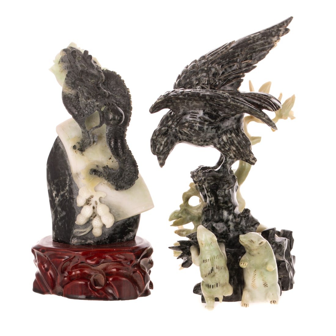 Two Chinese Carved Hardstone Figural Groups: 1) A dark and light green Chinese carved hardstone figural group of a perched bird looking down at two small unidentified animals, 8 1/2 in. H, approx. 4 3/4 in. W, 4 1/4 in. D; and 2) A dark and ligh