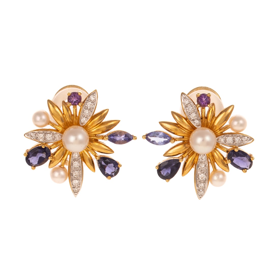 A Pair of Multi-Gemstone, Pearl & Diamond Ear Clips in 18K: 18K yellow gold ear clips of starburst form with a central cultured pearl 5.9 mm from which radiates round diamonds pave set, oval shape and pear shape tanzanite, marquise cut iolite, round amethyst a