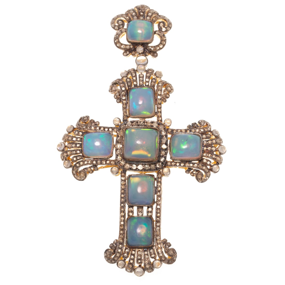 An Opal & Diamond Cross Pin/Pendant: Vermeil cross pin/pendant featuring a large cross with well matched opal cabochons with strong blue, green, and pink play-of-color bezel set in a open work Art Deco style cross with bead set rose cut 