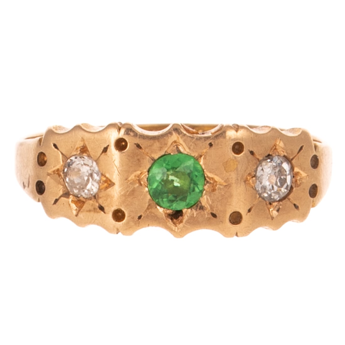 A Victorian Tsavorite Garnet Ring in 15K: c.1881, 15K yellow gold ring with hallmarks, Birmingham, England featuring a round tsavorite garnet bead set in the center of an engraved star flanked by two Old European diamonds bead set in the cent