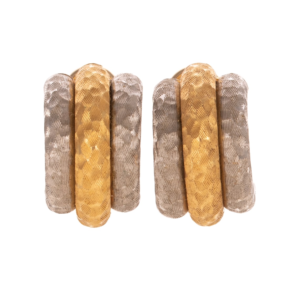 A Pair of Two Toned Textured Earrings in 18K: 18K yellow and white gold half hoop earrings with engraved hammered finish, posts with Omega backs, signed "TRG," 3/4 in. L, 9.1 grams Provenance: From the Estates of Linda D. Segal and Elsie D. Segal