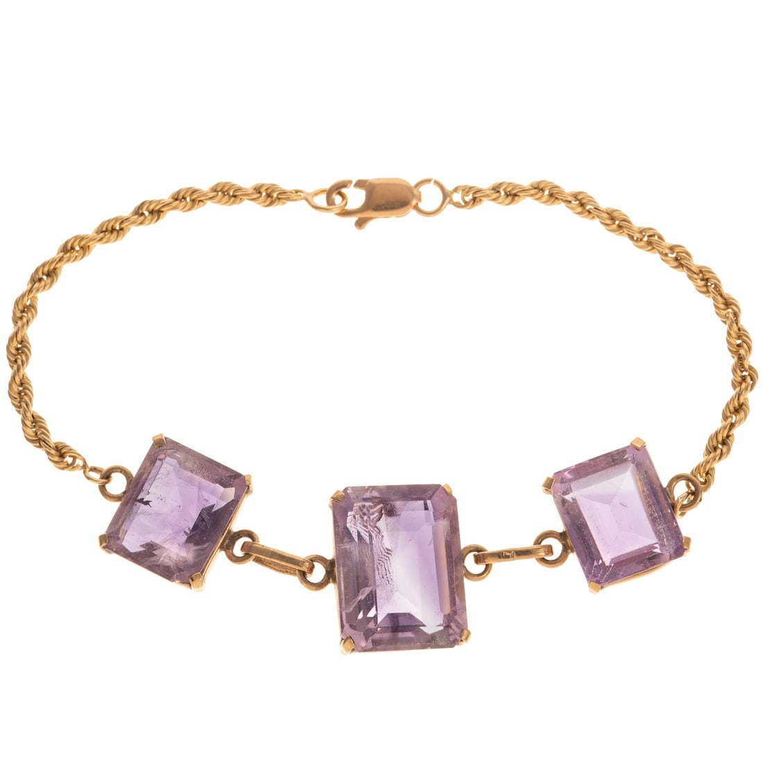 An Amethyst Bracelet with Rope Chain in 14K: 14K yellow gold bracelet featuring three well matched emerald cut amethyst, graduating in size from 12 x 15 mm in the center and 10 x 12 mm on the sides, rope chain finishing the remainder of bracelet