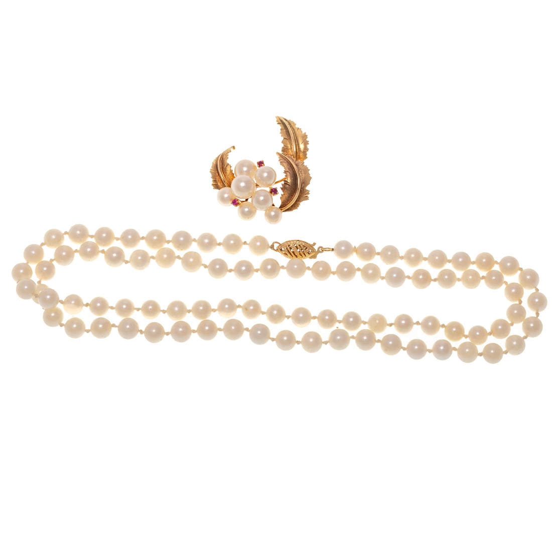 A Pearl & Ruby Pendant in 14K & Matinee Strand of Pearls: 1) 14K yellow gold pendant featuring a cluster of seven cultured pearls with rose overtones ranging from approx. 5 - 7 mm with three round ruby accents prong set and three well modeled matte and high 
