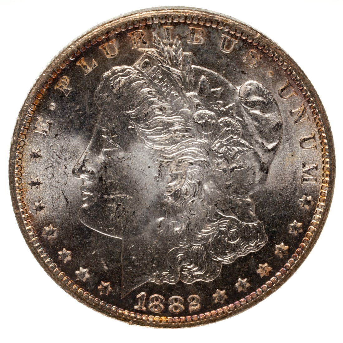 1882-CC Morgan MS62-63: Attractive eye appealing luster that really swirls on the reverse Provenance: Lifetime numismatic property of a long time Baltimore collector