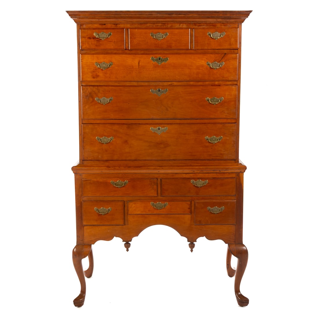 Queen Anne Style Maple Highboy: Early 20th century, two part highboy with cornice top, three over three-drawer configurated upper case resting on a two over three drawer base with scalloped apron with drop finials on cabriole legs