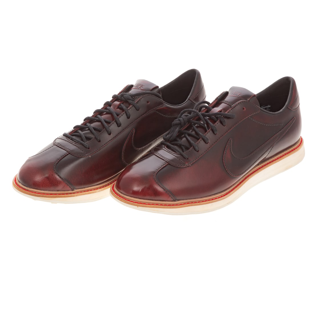A Pair of Nike 1972 QS: A pair of deep red pair of Nike 1972 QS, 2012, #586367-600, men's size 11.5, includes original box Provenance: From the Estate of Sean Conway, Annapolis, MD and Los Angeles, CA, an accomplished artist
