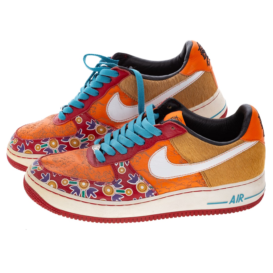 A Pair Nike Air Force 1 Low Year of the Dog: A pair of orange and multicolor Nike Air Force 1 Low "Year of the Dog" sneakers, 2005, #313404-611, men's size 9, includes a box (not original box) Provenance: From the Estate of Sean Conway, Annapoli