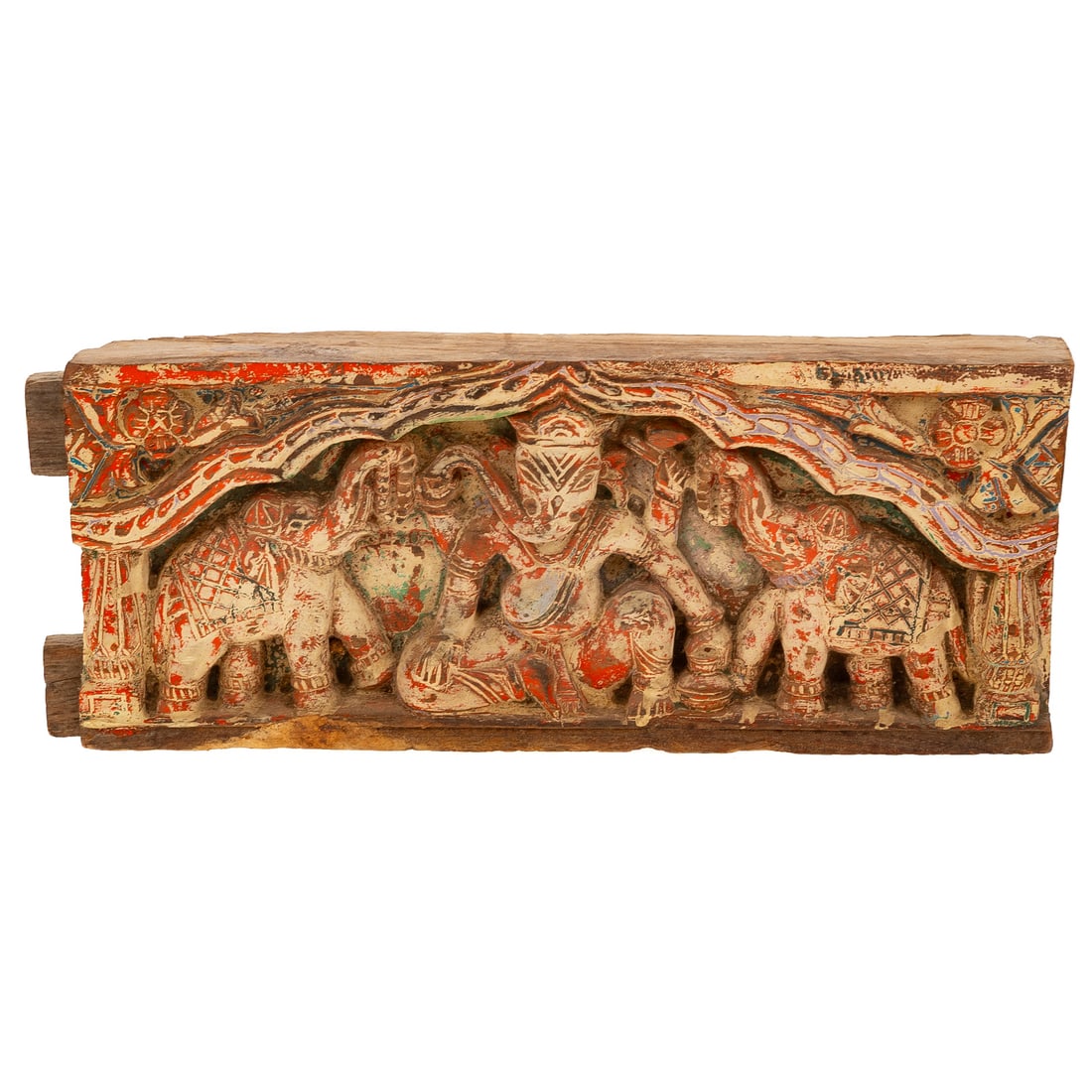 A Hindu Architectural Hand-Carved Wooden Panel: A hand-carved Hindu architectural painted wooden panel depicting Ganesha as the central figure with an elephant on either side, 6 1/2 in. H, 16 1/2 in. L, approx. 2 1/2 in. D