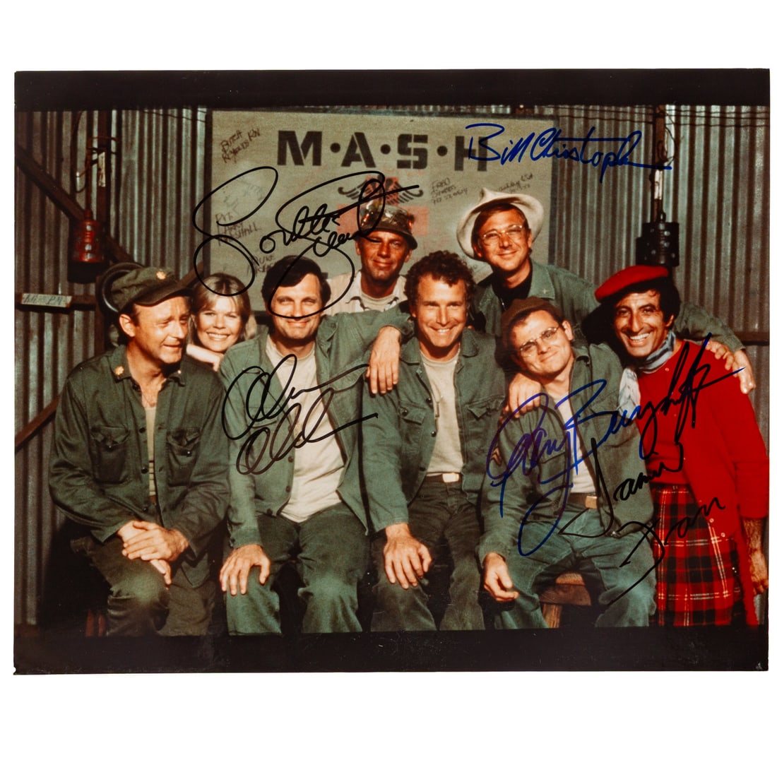 A Signed M*A*S*H Cast Photograph: A signed color photograph of the main cast of M*A*S*H (creator Larry Gelbart, 1972 - 1983), featuring signatures from Alan Alda, Jamie Farr, Gary Burghoff, Loretta Swit, and Bill Christopher, 8 in. x 