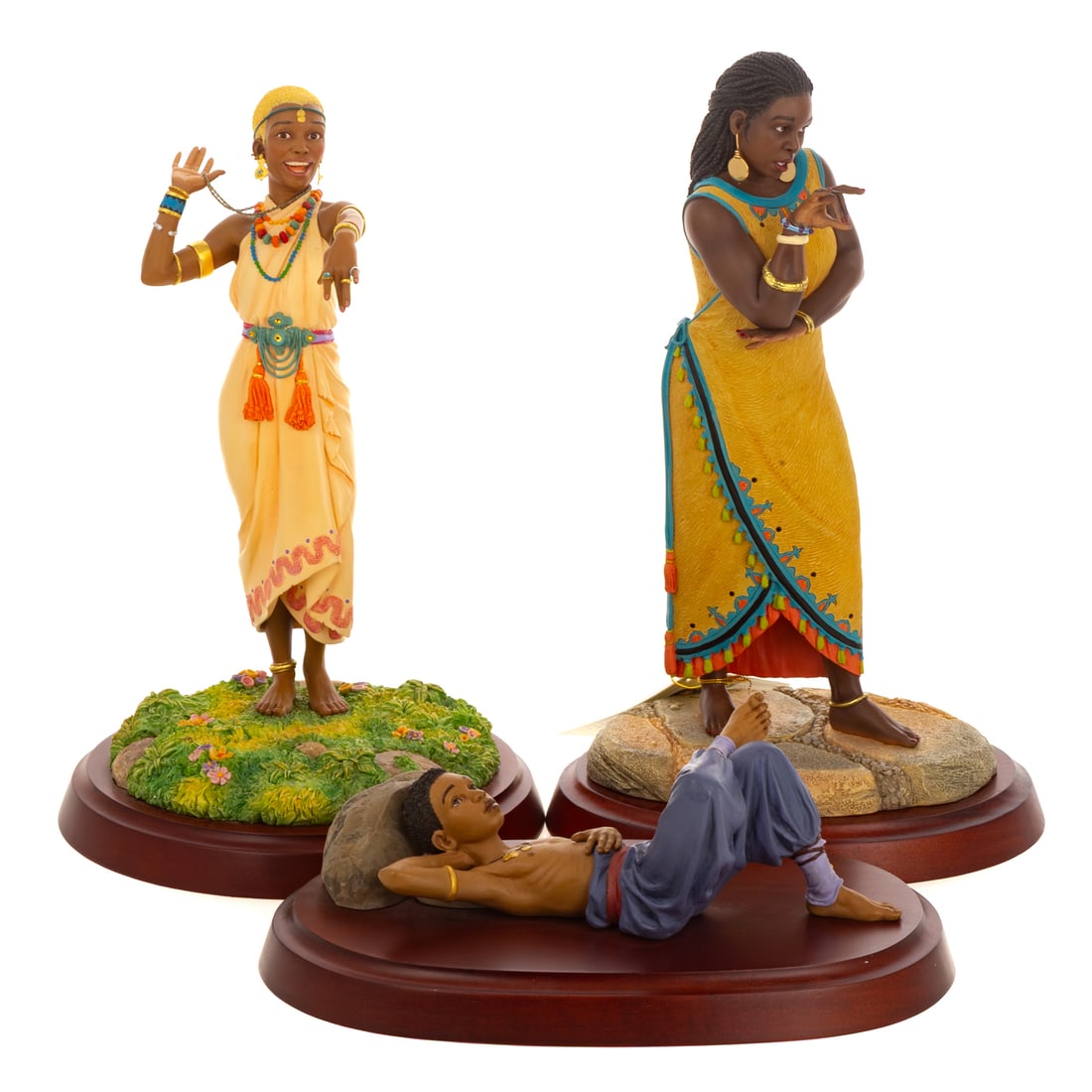 Three Thomas Blackshear's Ebony Visions Figures: Including a hand cast resin Thomas Blackshear's "A Time to Dream" depicting a young boy laying down and looking up to the sky, limited edition, stamped, marked on bottom, includes original box, 4 in. 