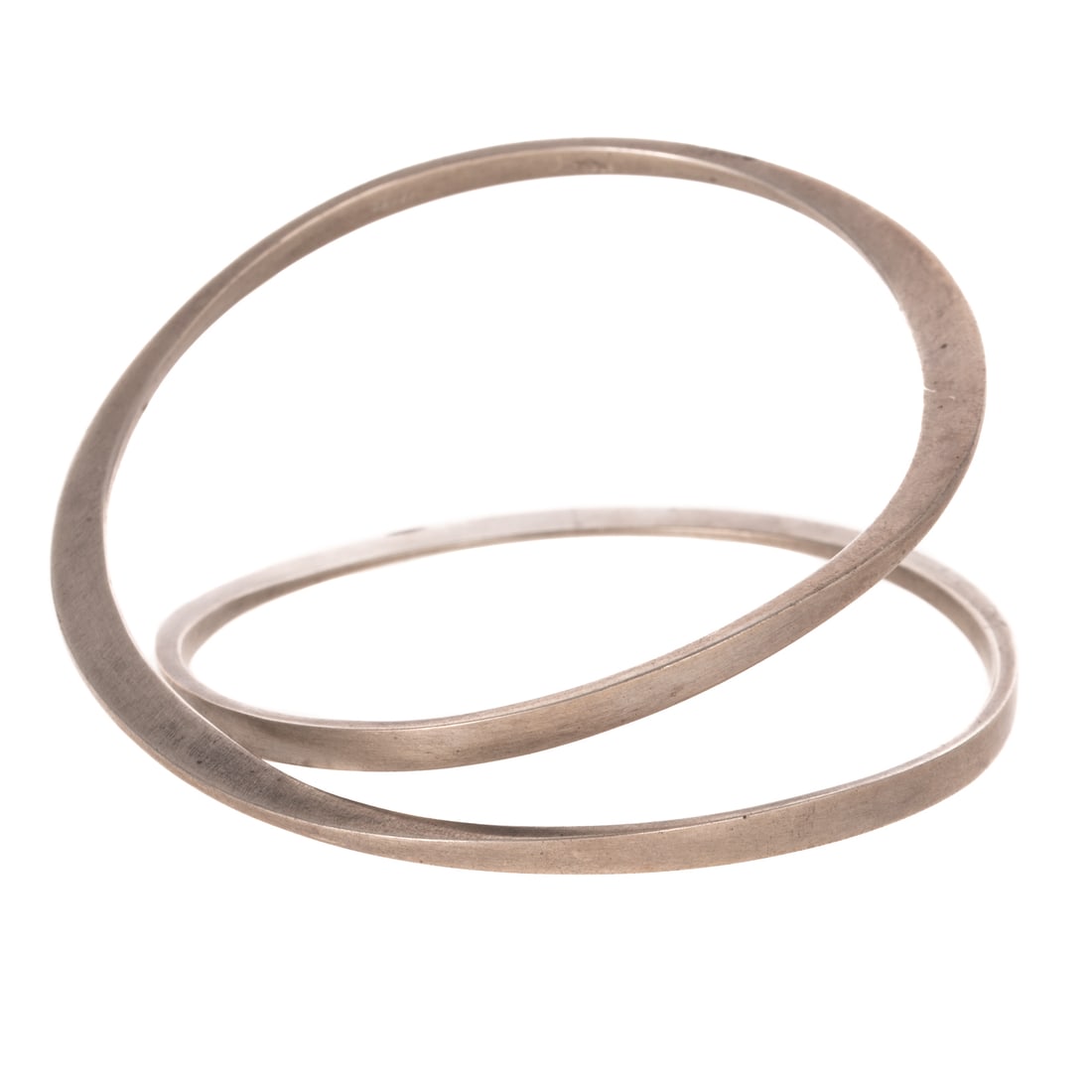 A Betty Cooke Double Loop Bangle in Sterling Silver: Sterling silver double loop slip on bangle bracelet by Betty Cooke (1924 - 2024), Baltimore, MD forged silver, high polish finish, signed, interior Diam. 2 3/8 in., 28.6 grams Provenance: From the Est