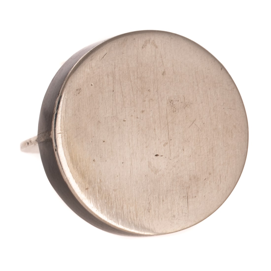 A Betty Cooke Ebony Disc Ring in Sterling Silver: Sterling silver ring by Betty Cooke (1924 - 2024), Baltimore, MD designed with an ebony wood disc and sterling silver high polish disc, 1 in. W, flat shank, signed, sz 6.5, 11.4 grams Provenance: From