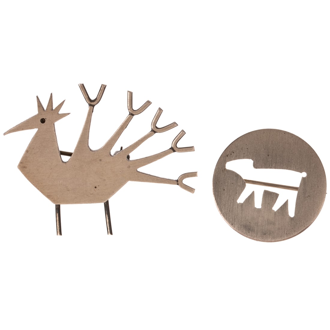 Two Betty Cooke Animal Brooches in Sterling Silver: 1) Sterling silver disc brooch by Betty Cooke (1924 - 2024), Baltimore, MD with cut out animal, matte finish, signed, 7/8 in. Diam., and 2) Sterling silver brooch by Betty Cooke (1924 - 2024), Baltimo