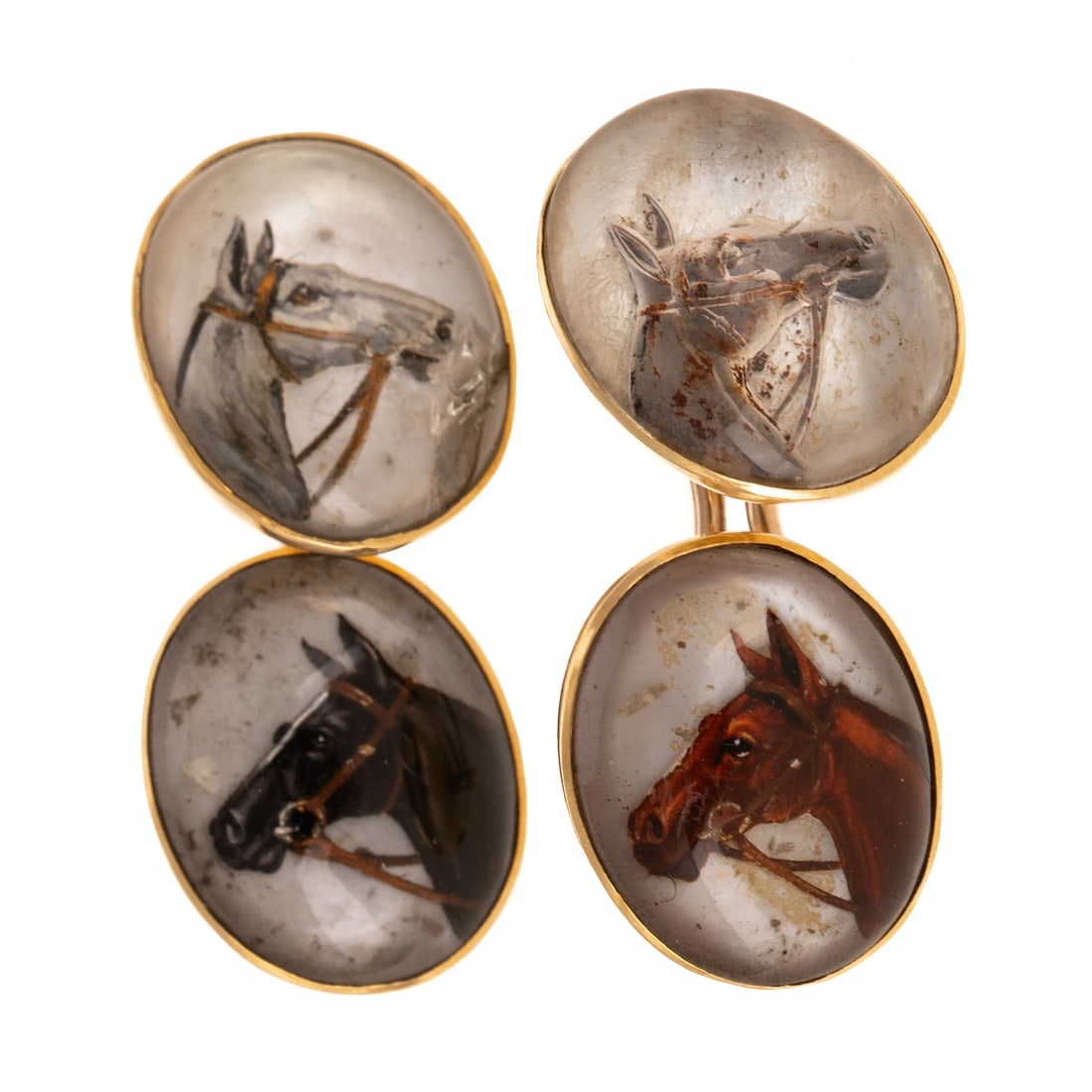 A Pair of Essex Crystal Equestrian Cufflinks in 18K: 18K yellow gold double sided cufflinks featuring Essex crystal horse head portraits in bezel setting with removable clip connectors, each crystal 5/8 in. W, 10.8 grams