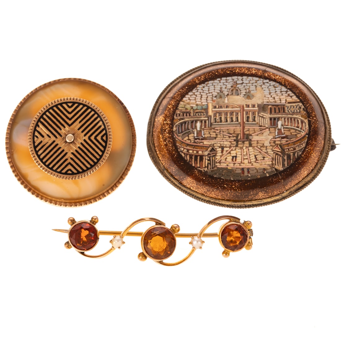 A Trio of Antique Brooches: 1) 14K yellow gold Scottish pin/pendant with a round agate disc bezel set with fluted border and central geometric disc with black enamel details, C clasp, 1 1/4 in. Diam., 2) 9K yellow gold Scottish 