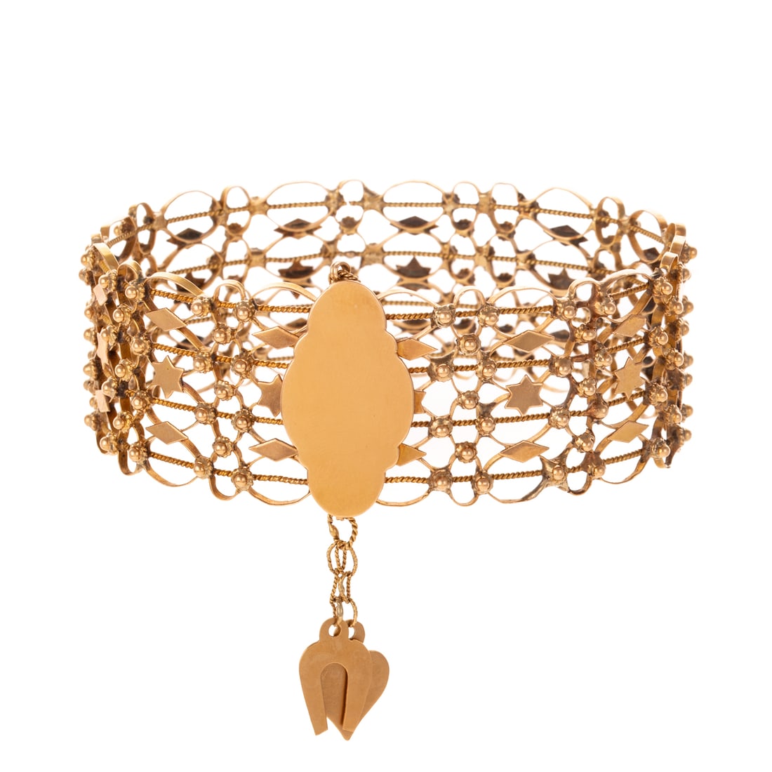 A Wide Woven Bracelet with Charms in 18K: 18K yellow gold wide woven bracelet with alternating star and diamond shape, high polish accents along with two dangling charms: a heart and horseshoe, hidden bar clasp with high polish plaque for